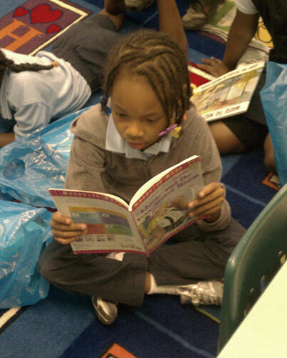 A child engrossed in reading a book